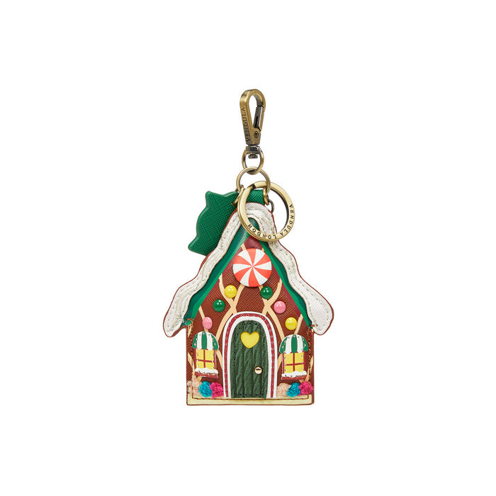 Gingerbread house keychain with a gold clasp on a white background