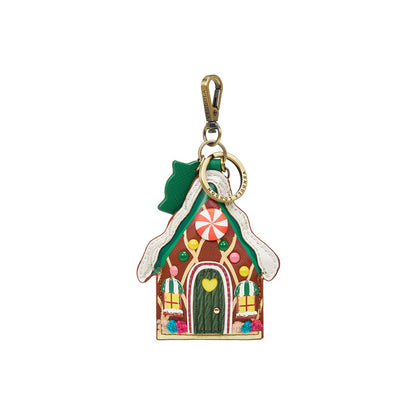 Gingerbread house keychain with a gold clasp on a white background