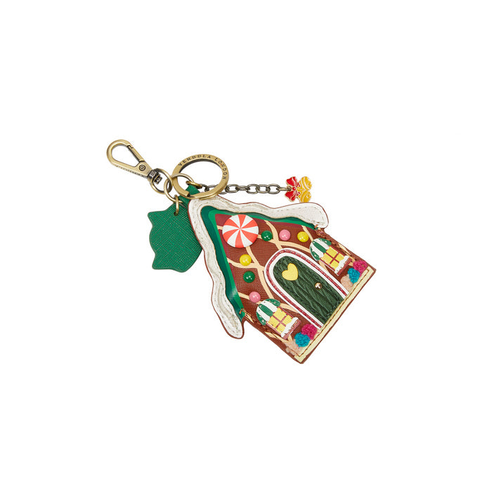 Colorful gingerbread house keychain with a white background