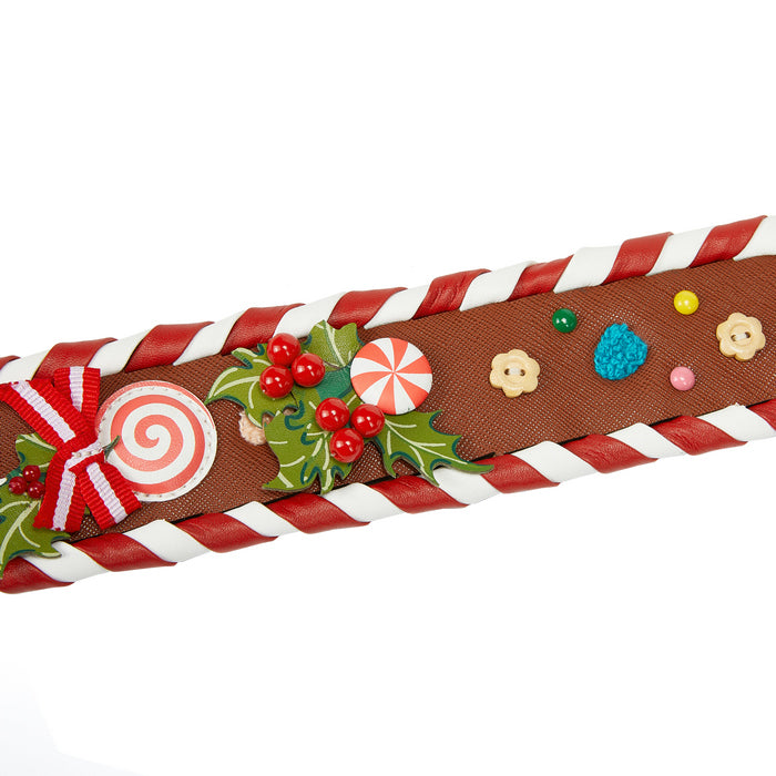 Decorative ribbon with candy-themed decorations on a white background