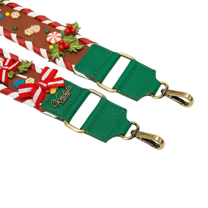 Green strap with Christmas-themed decorative ends on a white background