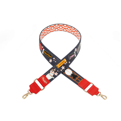 Decorative strap with floral and train design on a white background
