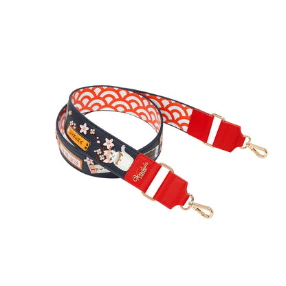 Multicolored strap with floral design and gold clasp on a white background