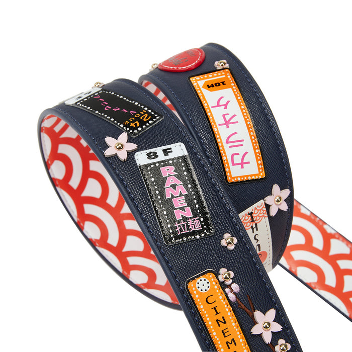 Decorative belt with colorful patterns and text on a white background