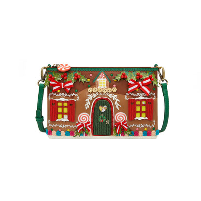 Gingerbread house-themed handbag with candy decorations on a white background