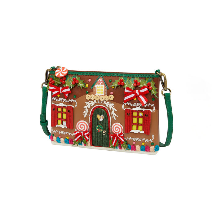 Gingerbread house-themed crossbody bag on a white background