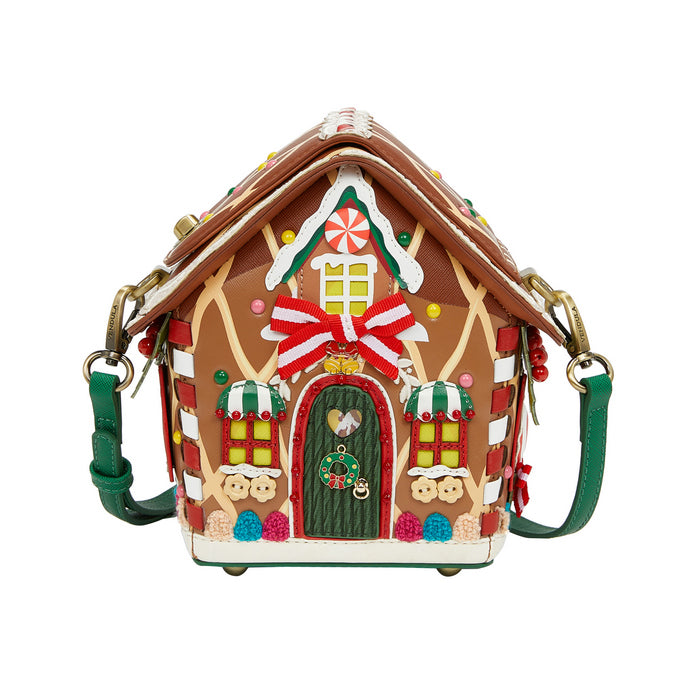 Gingerbread house-shaped handbag with decorative elements on a white background