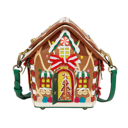Gingerbread house-shaped handbag with decorative elements on a white background