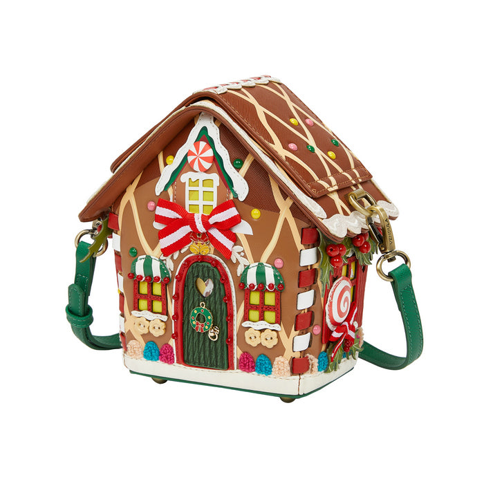 Gingerbread house-shaped handbag with decorative elements on a white background