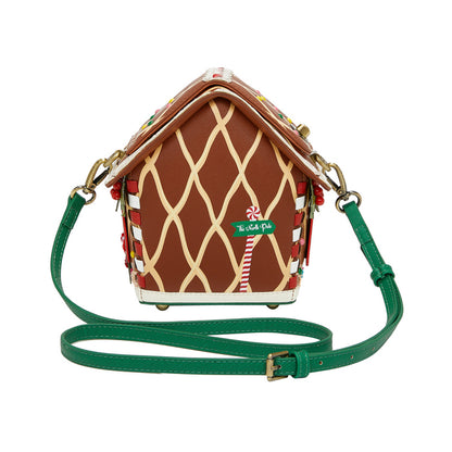 Gingerbread house-shaped handbag with a green strap on a white background