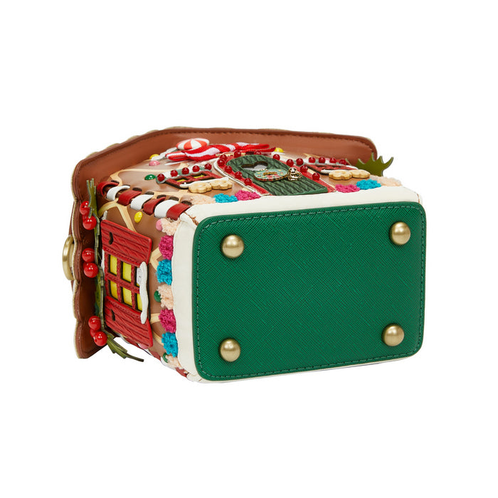 Green textured handbag with decorative elements on a white background