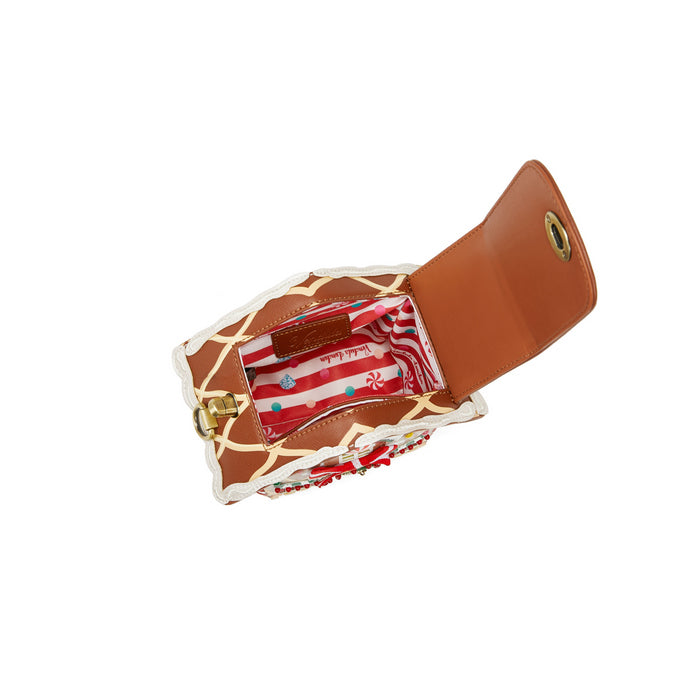 Giraffe-patterned wallet with a red interior on a white background