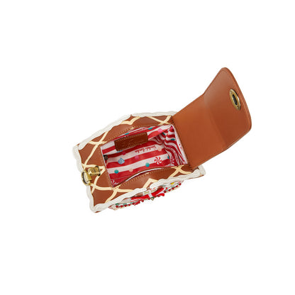 Giraffe-patterned wallet with a red interior on a white background