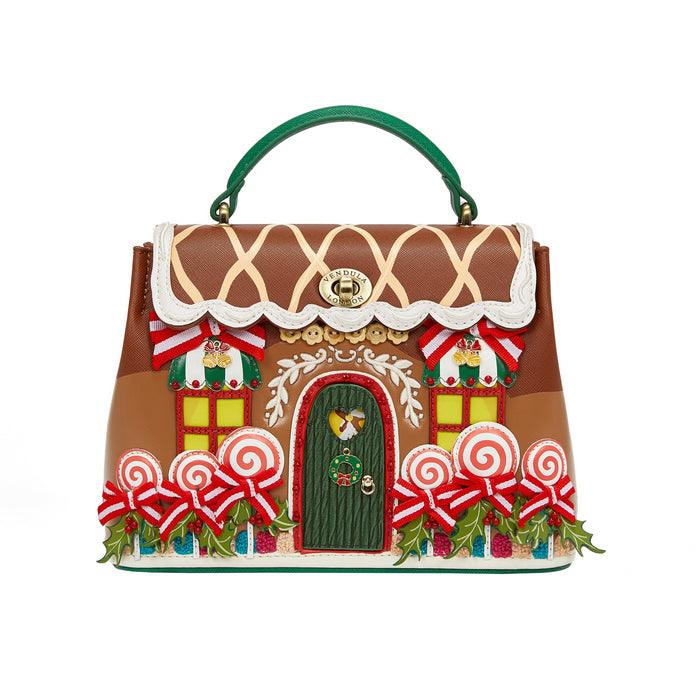 Gingerbread house-themed handbag with decorative elements on a white background
