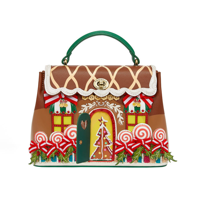 Gingerbread house-themed handbag with decorative elements on a white background