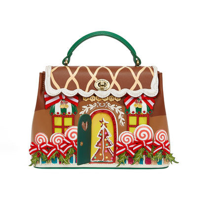 Gingerbread house-themed handbag with decorative elements on a white background