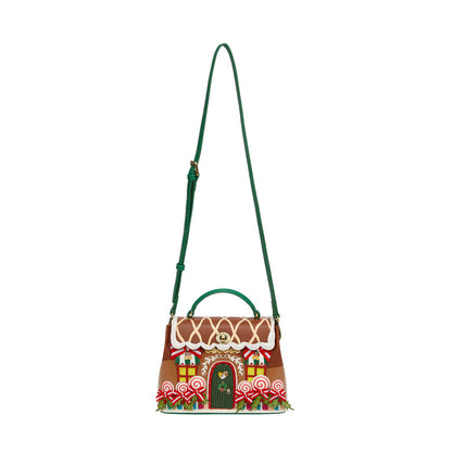 Gingerbread house-themed handbag with a green strap on a white background
