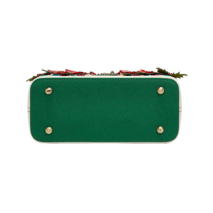 Green handbag with floral design on a white background