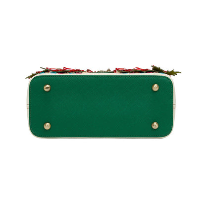 Green handbag with floral design on a white background