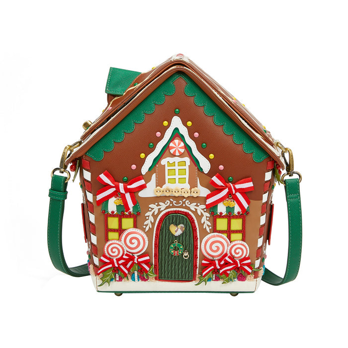 Gingerbread house-shaped handbag with decorative elements on a white background