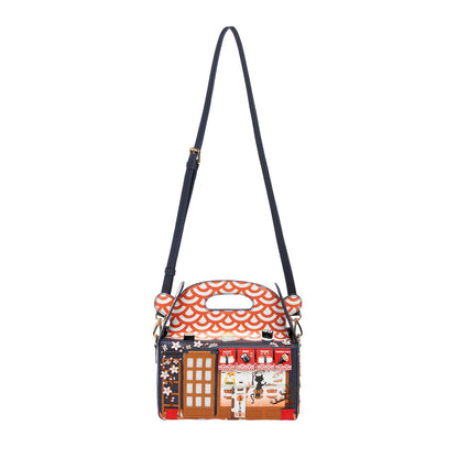 Handbag with a decorative design on a white background