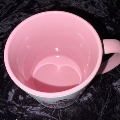 Pink plastic container on a textured black surface