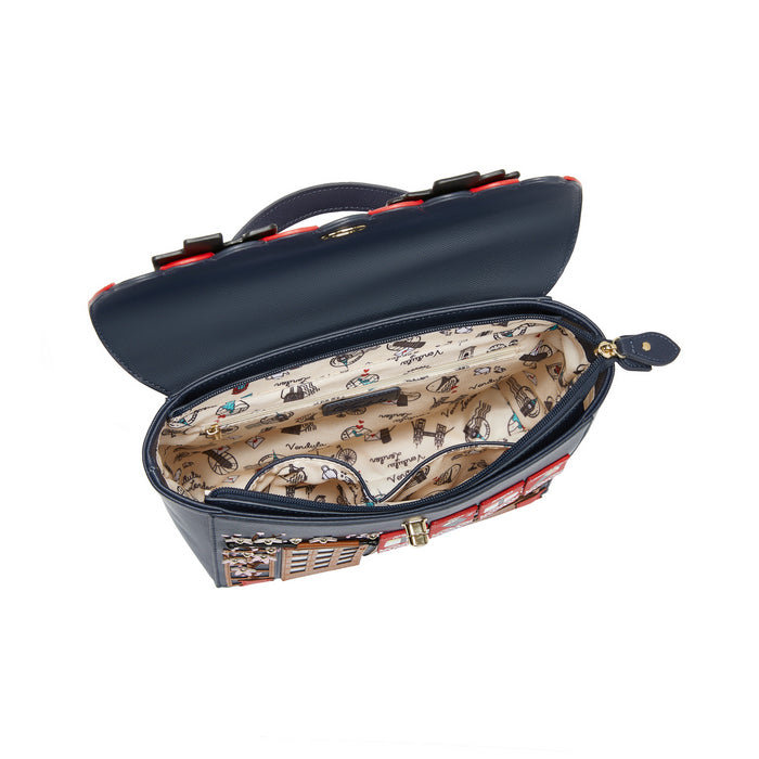 Open navy blue handbag with patterned interior on a white background