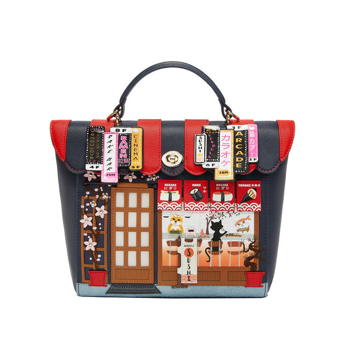 Handbag with colorful design featuring a door and various elements on a white background