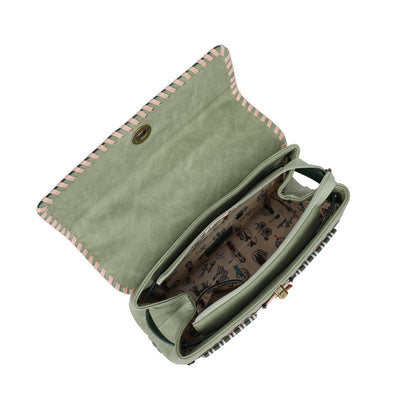 Green clutch bag with patterned interior on a white background