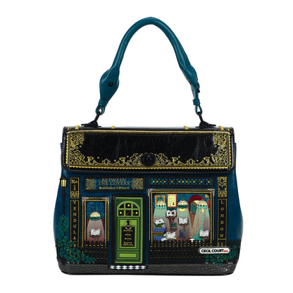 Decorative handbag with artistic designs and text on a white background