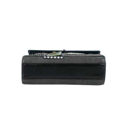 Black clutch bag with a textured pattern on a white background