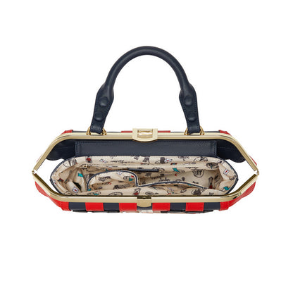Handbag with a patterned interior on a white background