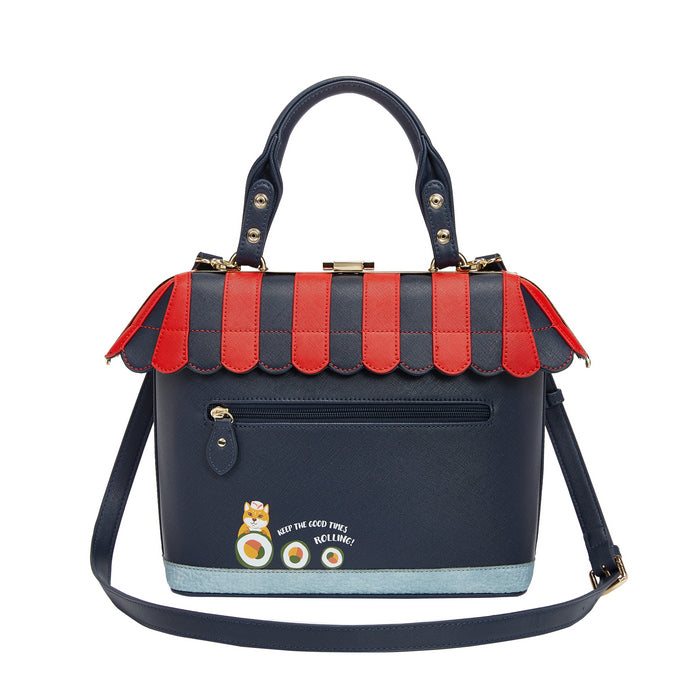 Navy and red handbag with decorative elements on a white background