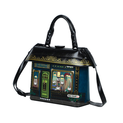 Handbag designed like a pub facade with decorative elements on a white background