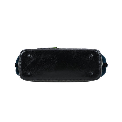 Black leather handbag with decorative elements on a white background