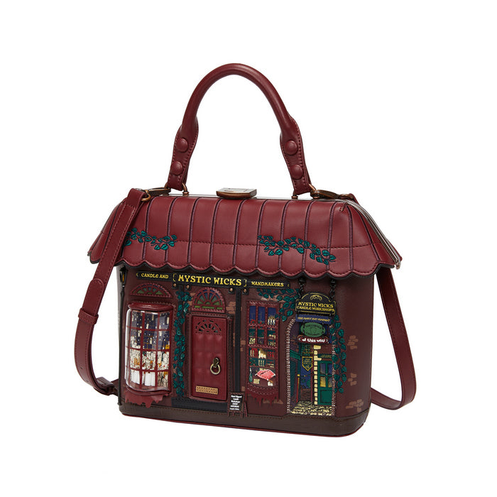 Red handbag designed like a store front with 'Mystic Micks' branding on a white background