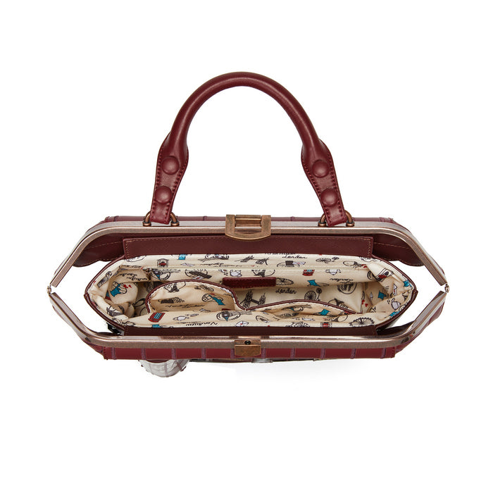 Brown handbag with a patterned interior on a white background
