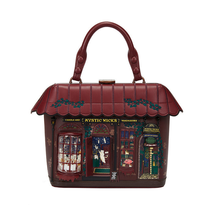 Handbag designed like a store front with 'Mystic Wicks' branding on a white background