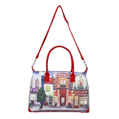 Handbag with a cityscape design and red handles on a white background