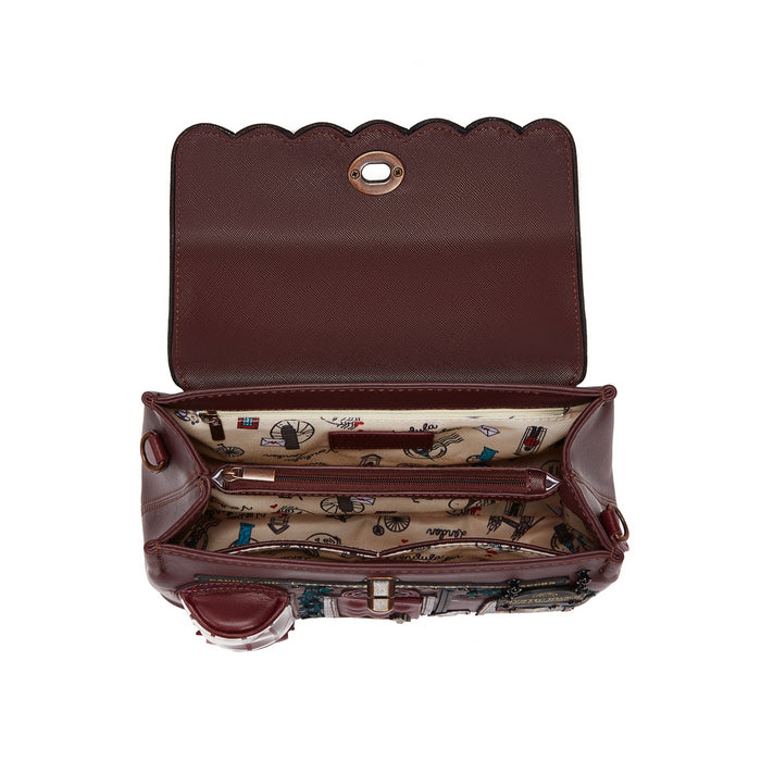 Brown leather handbag with open flap showing interior lining on a white background
