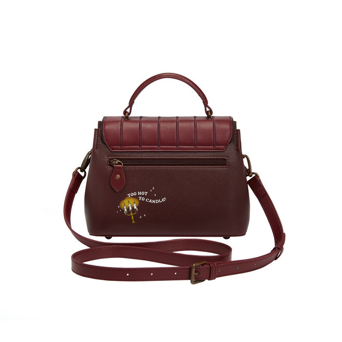 Brown leather handbag with a strap on a white background