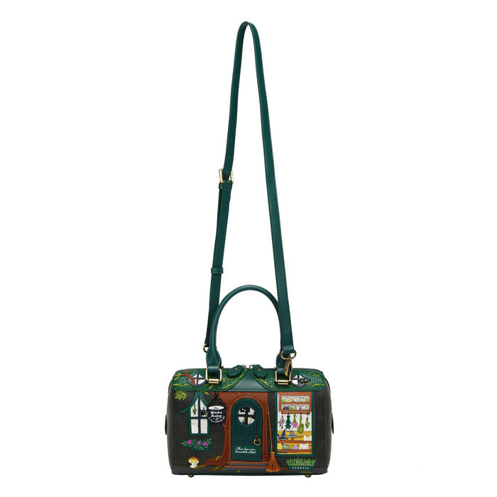 Green handbag with decorative design on a white background