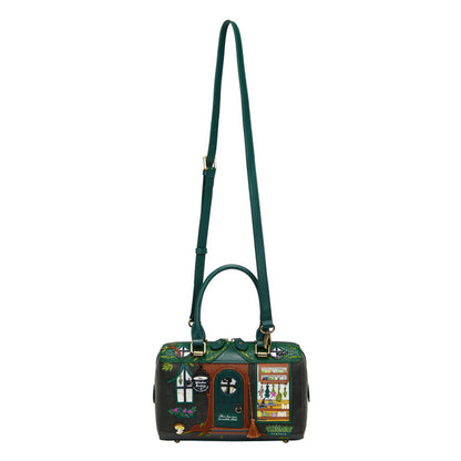 Green handbag with decorative design on a white background