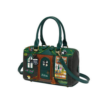 Green handbag with decorative design on a white background