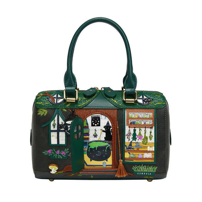 Handbag with a detailed design of a witch's house and various elements on a white background