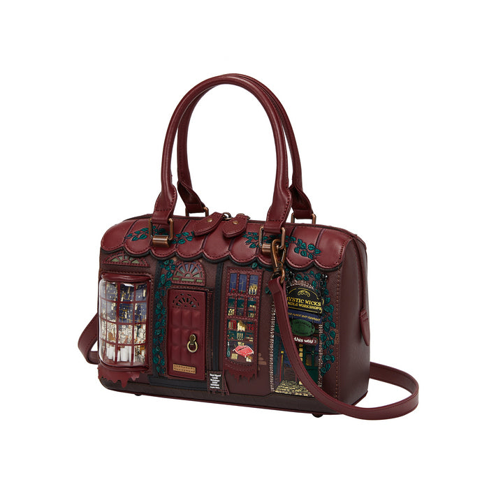 Decorative handbag with intricate designs on a white background