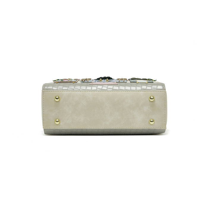 Beige handbag with decorative elements on a white background