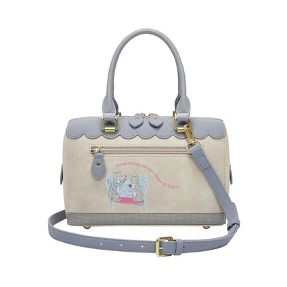 Handbag with decorative elements and text on a white background
