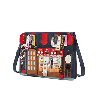 Crossbody bag with a colorful design of a street scene and building facades.
