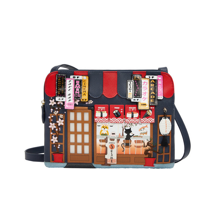 Handbag with a design of a street scene and building facades on a white background